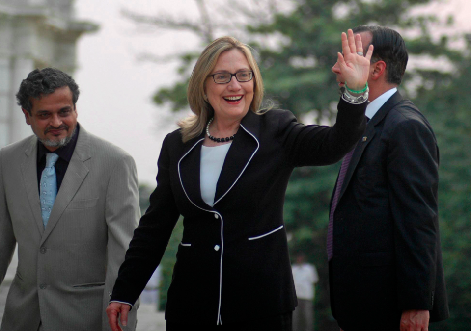 U.S. Secretary of State Hillary Rodham Clinton, waves during a visit to the Victoria Memorial Hall in Kolkata, India, Sunday, May 6, 2012. (AP Photo)