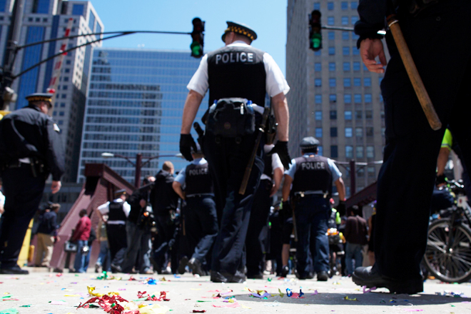 Chicago police officers walk away from an anti-NATO protest march on Monday. (Reuters/Andrew Kelly)