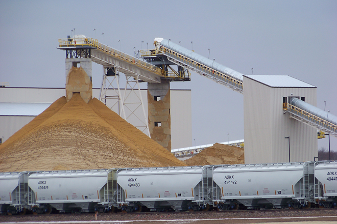 Frac sand piles up at a processing plant in Chippewa Falls, Wis. (AP/Steve Karnowski)