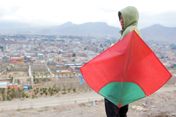 A child flies a kite in Kabul on Tuesday Mar. 27, 2012. (Geoffrey Ingersoll)