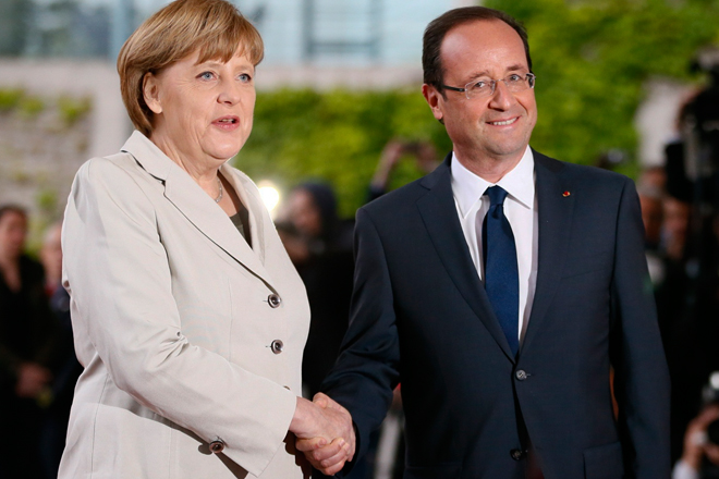 Angela Merkel and Francois Hollande in Berlin on Tuesday, (Reuters/Fabrizio Bensch)