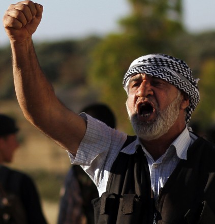 A Free Syrian Army officer chants slogans during a training session on the outskirts of Idlib, Syria. (Associated Press)