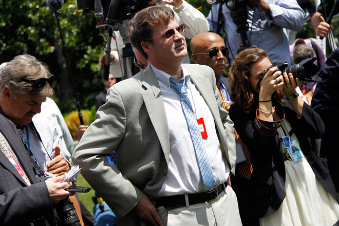 Neil Munro of the Daily Caller listens to President Obama at a press conference on Friday. (AP/Haraz N. Ghanbari)