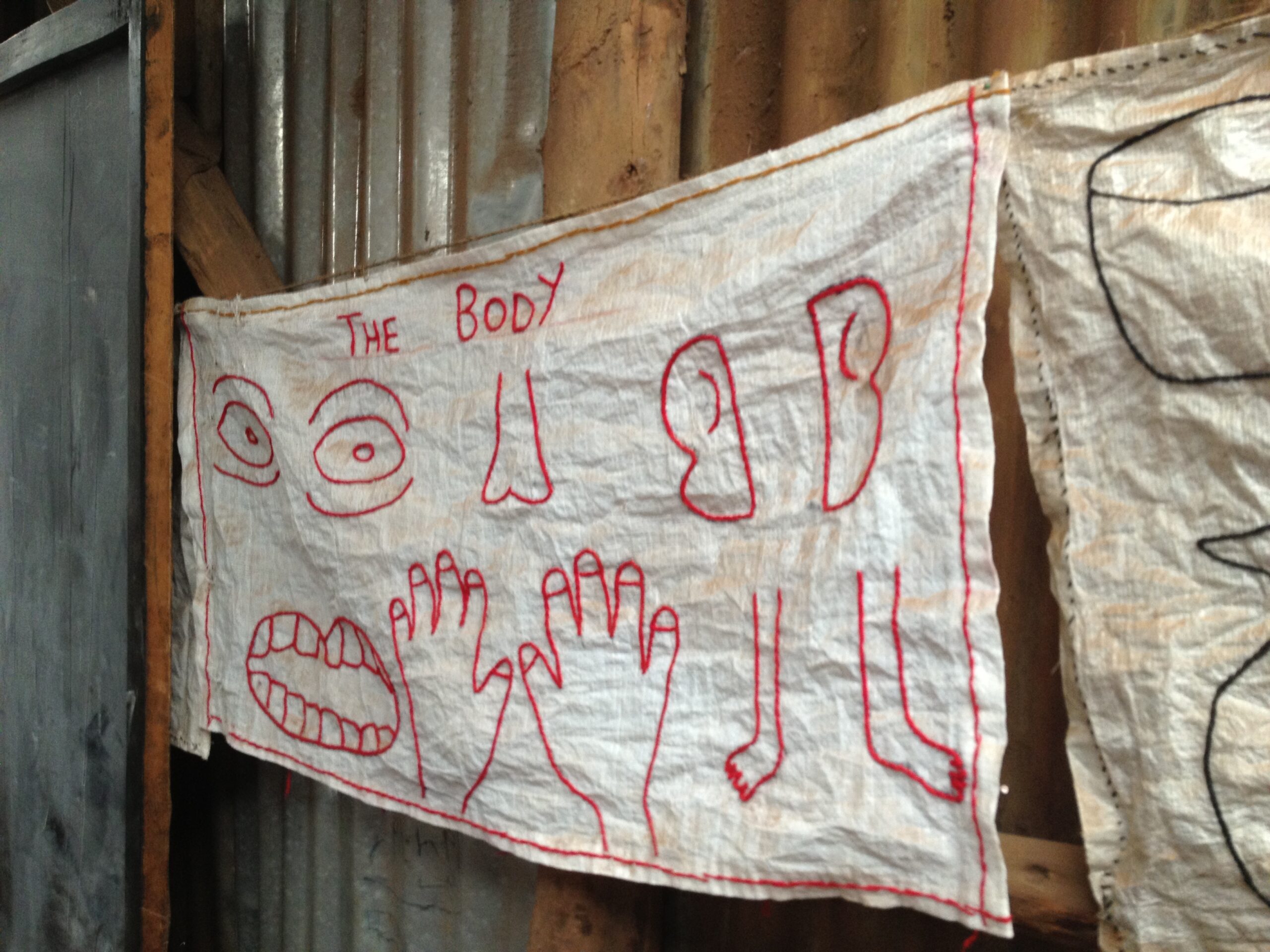 A hand-embroidered poster in a Kibera primary school. (Irin Carmon)