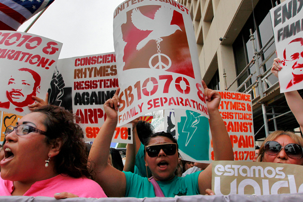 Protesters march against Arizona's illegal immigration law in Phoenix. (AP/Matt York)