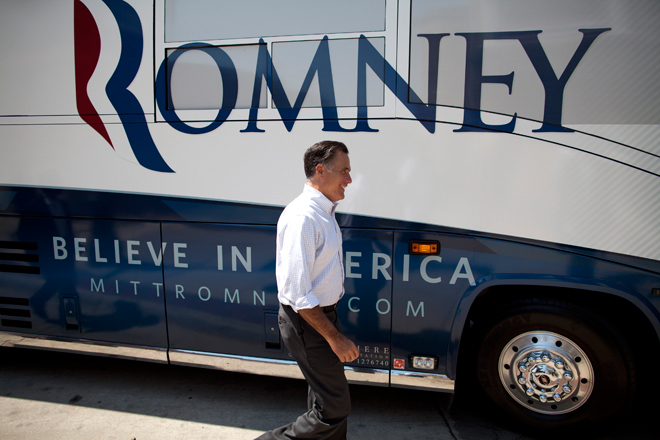 Mitt Romney in front of his campaign bus. (AP/Evan Vucci)