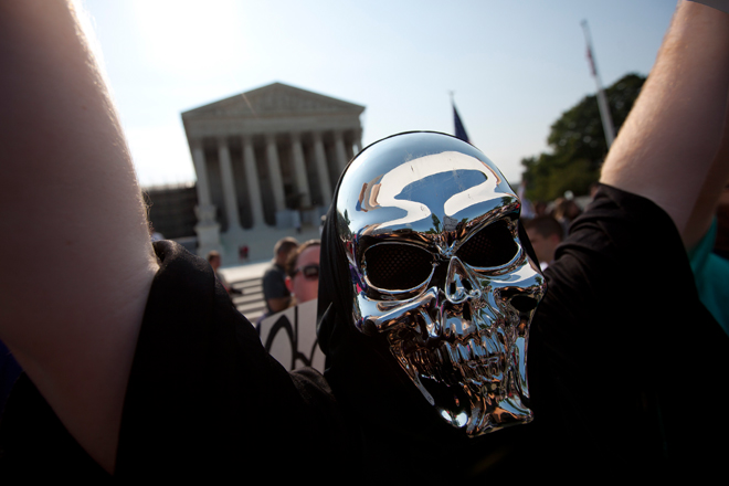 A demonstrator outside the Supreme Court on Thursday. (AP/Evan Vucci)