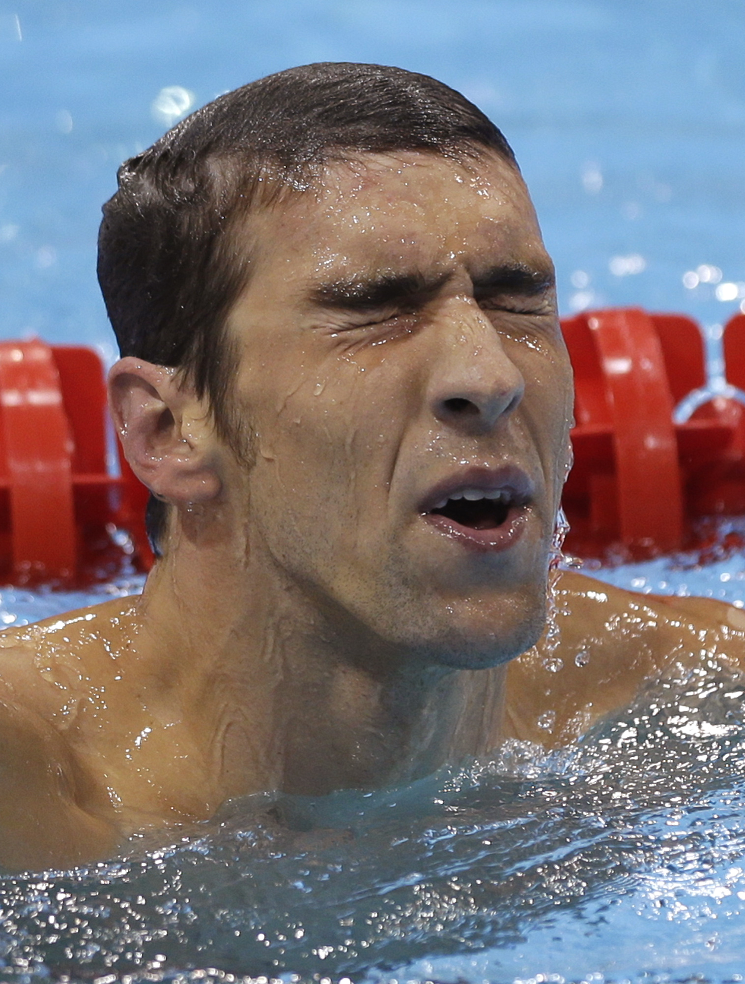 United States' Michael Phelps makes his way out of the pool after placing fourth in the men's 400-meter individual medley swimming final. (AP/David J. Phillip)