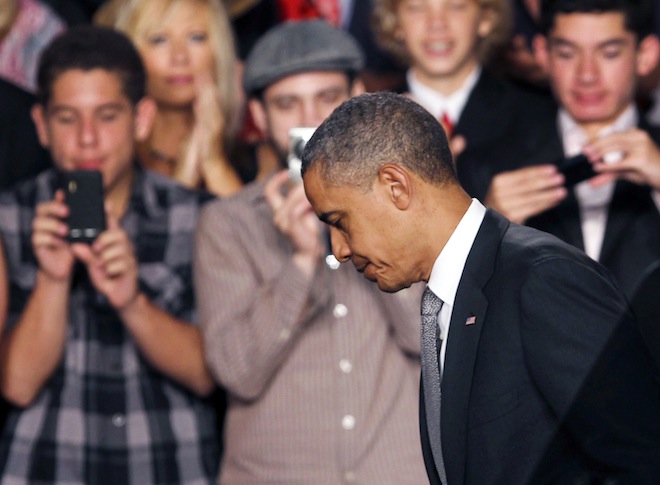 President Barack Obama walks down the steps after speaking about the Aurora, Colo., shooting at an event at the Harborside Event Center in Ft. Myers, Fla., Friday, July 20, 2012. (AP/Alan Diaz)