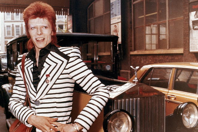 British rock singer, David Bowie, poses beside his Rolls Royce in May 1973. (AP Photo) (AP)