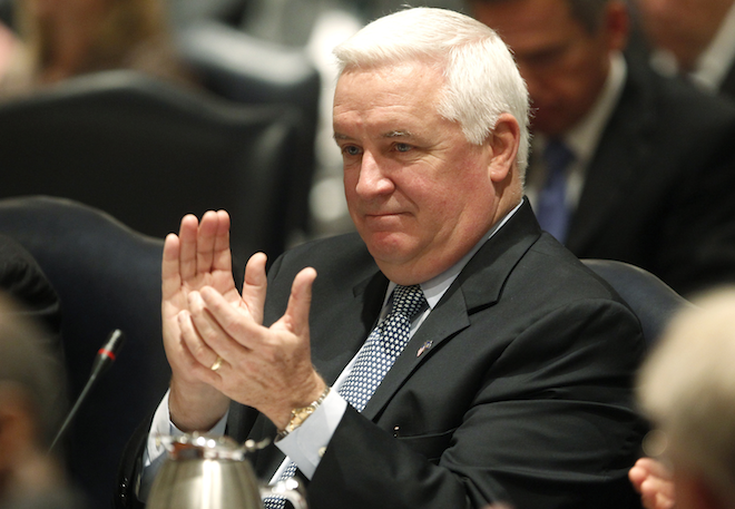 Pennsylvania Governor Tom Corbett applauds the introduction of Penn State University's interim president Rodney Erickson. (REUTERS/Tim Shaffer)
