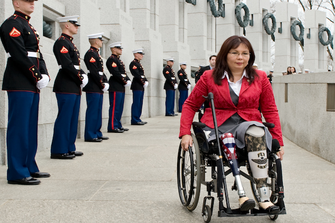 Tammy Duckworth arrives at the World War II Memorial in Washington for a ceremony honoring World War II veterans who fought in the Pacific. (AP Photo/Cliff Owen)