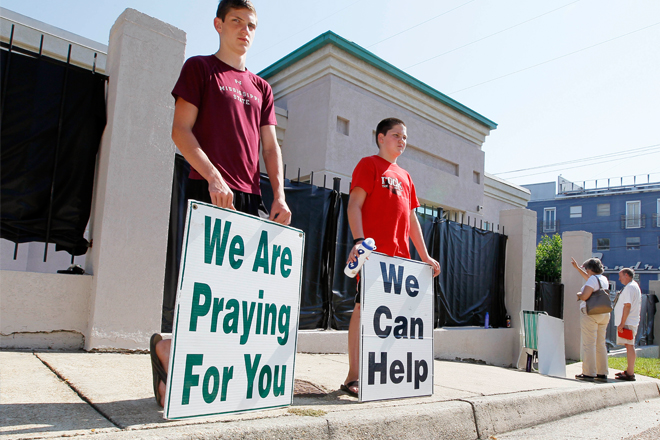 Anti-abortion advocates in Jackson stand outside Mississippi's only abortion clinic on June 27. (AP/Rogelio V. Solis)