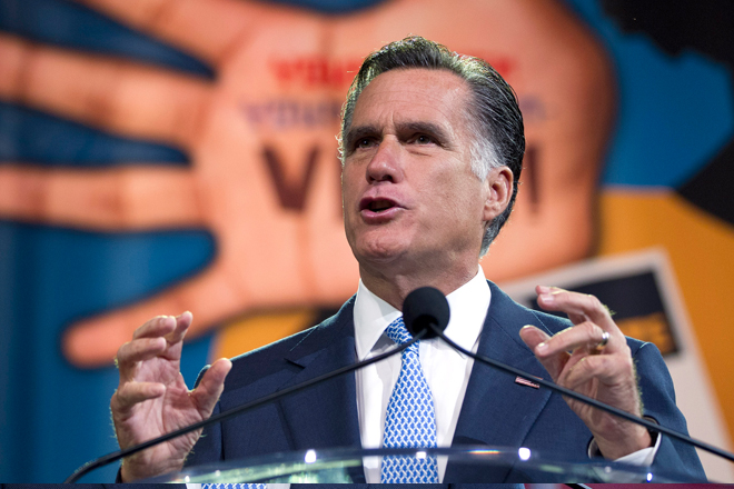 Romney gestures during a speech to the NAACP annual convention in Houston on Wednesday. (AP/Evan VUcci)