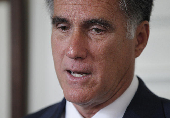 U.S. Republican presidential candidate Mitt Romney speaks to the press during his meeting with Labour Party leader Ed Miliband (not pictured) in London, July 26, 2012. (REUTERS/Jason Reed)