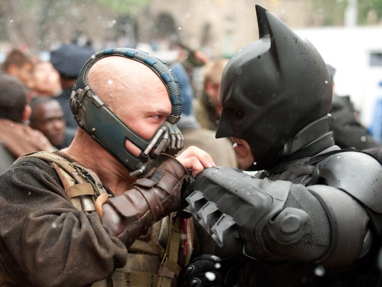 (L-r) TOM HARDY as Bane and CHRISTIAN BALE as Batman in Warner Bros. Picturesâ and Legendary Picturesâ action thriller âTHE DARK KNIGHT RISES,â a Warner Bros. Pictures release. TM and Â© DC Comics (Ron Phillips)