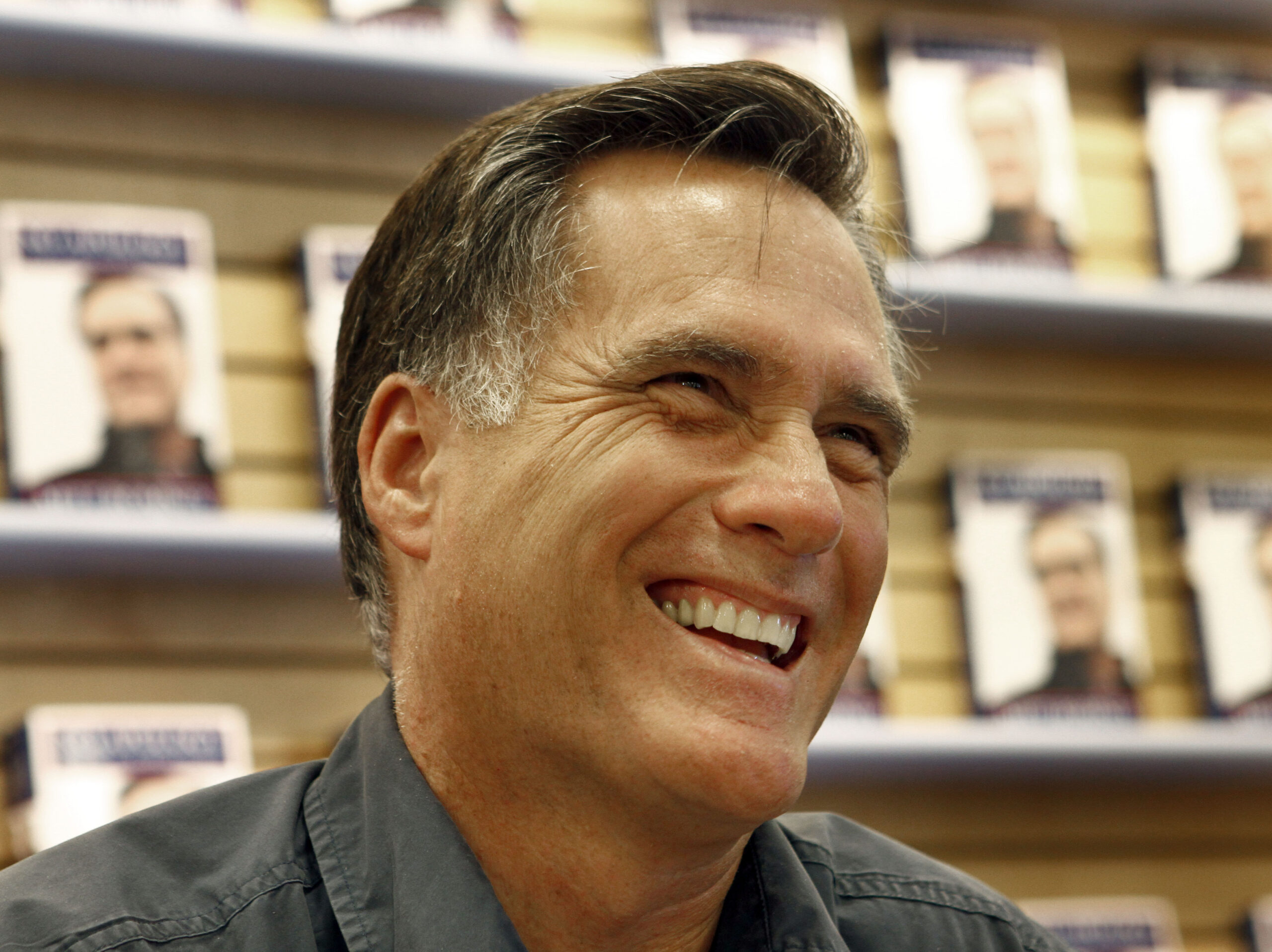 Republican presidential candidate and former Massachusetts gov. Mitt Romney signs copies of his book "No Apology: The Case for American Greatness" at a Barnes and Noble, Wednesday, April 7, 2010, in Manchester, N.H. (AP Photo/Mary Schwalm)