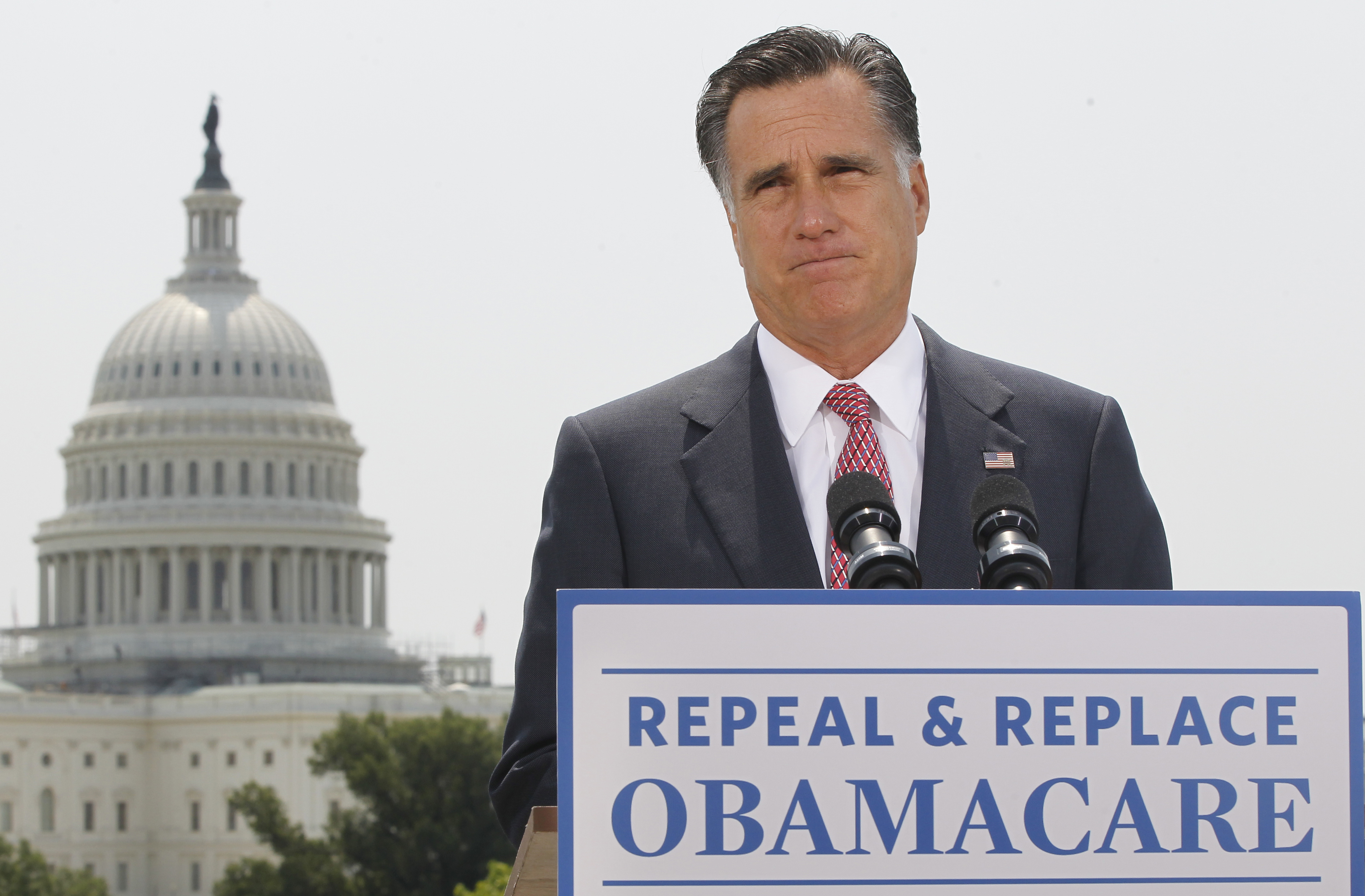 With the Capitol in the background, Republican presidential candidate, former Massachusetts Gov. Mitt Romney speaks about the Supreme Court's health care ruling, Thursday, June 28, 2012, in Washington. (AP Photo/Charles Dharapak) (Associated Press)