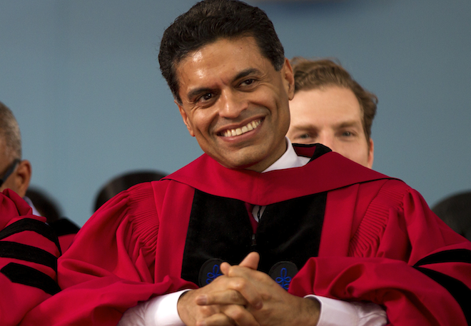 Journalist Fareed Zakaria is seated during Harvard University commencement exercises before being awarded an honorary Doctor of Laws from the University, in Cambridge, Mass., Thursday, May 24, 2012. (AP/Steven Senne)