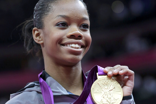 U.S. gymnast Gabrielle Douglas displays her gold medal (AP/Julie Jacobson)