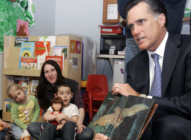 Republican presidential candidate and former Massachusetts Governor Mitt Romney (R) reads a book to children in a childcare program at the state's Easter Seals headquarters in Manchester, New Hampshire April 3, 2007. (REUTERS/Brian Snyder)