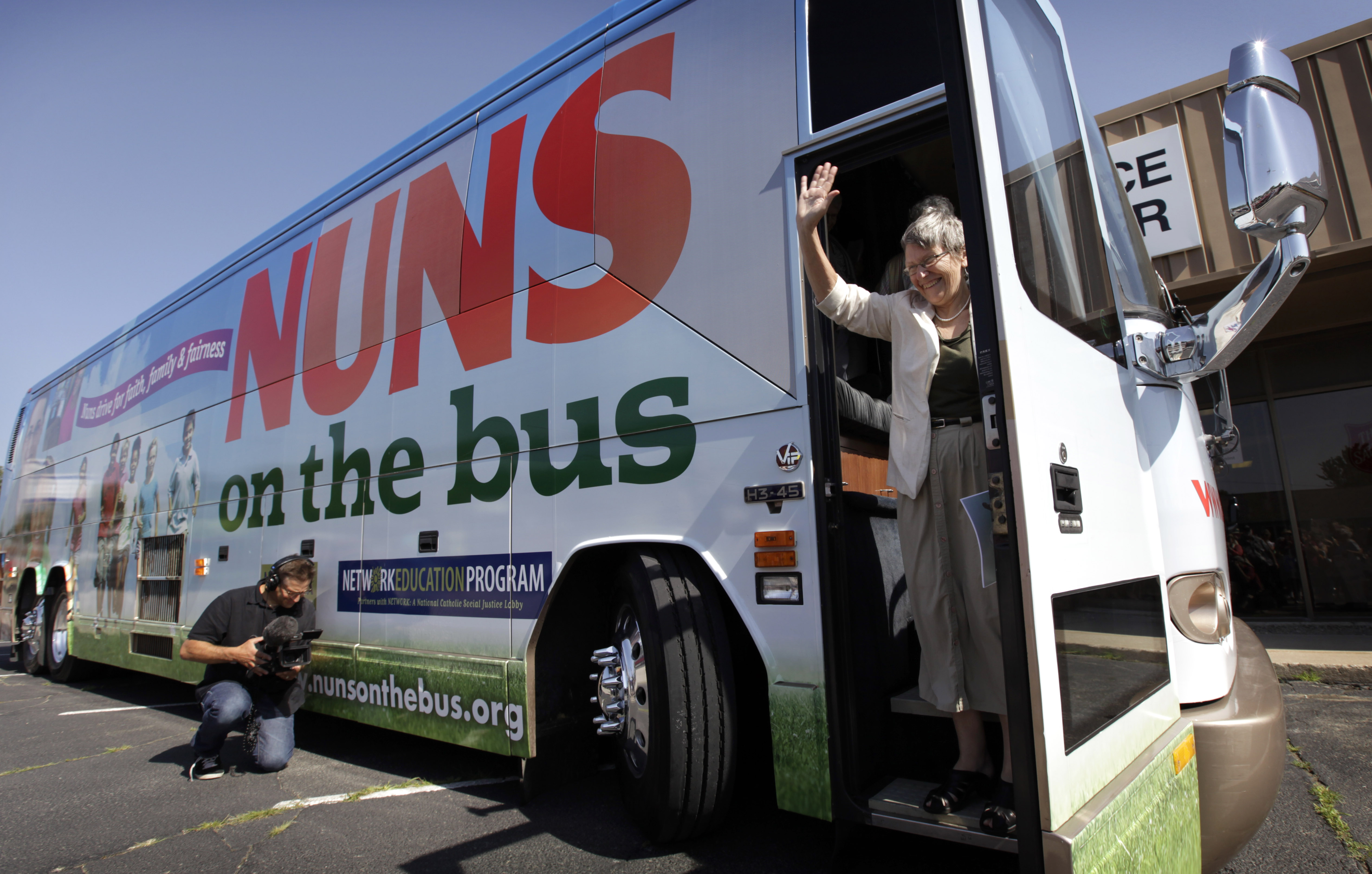 Sister Simone Campbell, executive director of Network, waves as she steps off the bus during a stop on the first day of a 9-state Nuns on the Bus tour, Monday, June 18, 2012, in Ames, Iowa. The group of Roman Catholic nuns say theyre not opposing any particular candidate but that their fight is with a Republican proposed federal budget they say hurts the poor and needy. (AP Photo/Charlie Neibergall) (Associated Press)