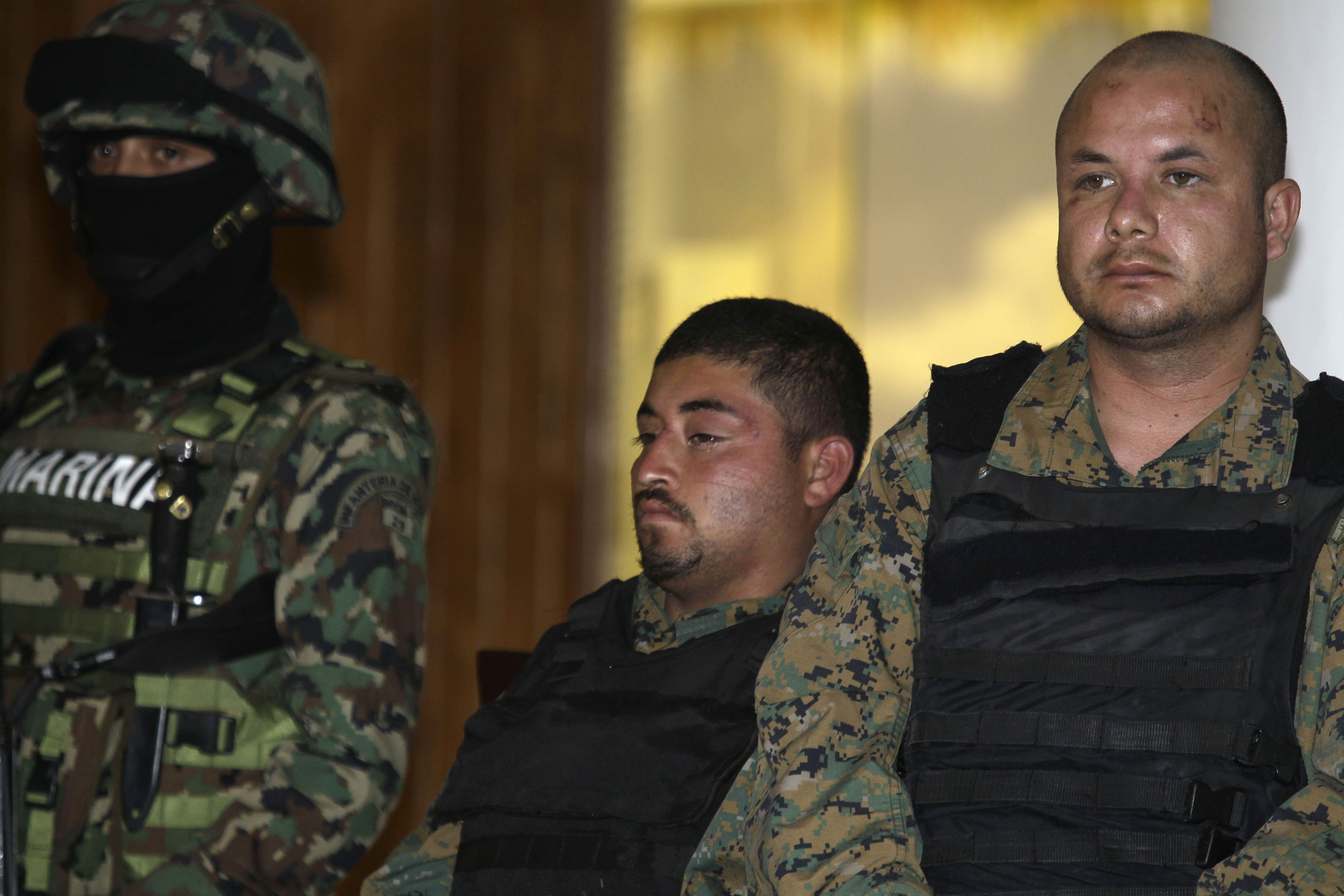 Two men believed to be bodyguards of the alleged leader of the Gulf drug cartel, Jorge Eduardo Costilla Sanchez, aka "El Coss." (AP/Dario Lopez-Mills)