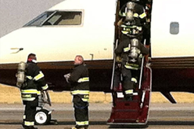 Firemen enter the plane carrying Ann Romney after the plane made an emergency landing in Denver on Friday. (AP/Romney for President)