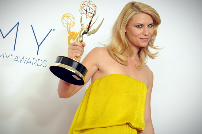 Actress Claire Danes, winner of the Outstanding Lead Actress In A Drama Series award for "Homeland," poses backstage at the 64th Primetime Emmy Awards at the Nokia Theatre on Sunday, Sept. 23, 2012, in Los Angeles. (AP/Jordan Strauss)