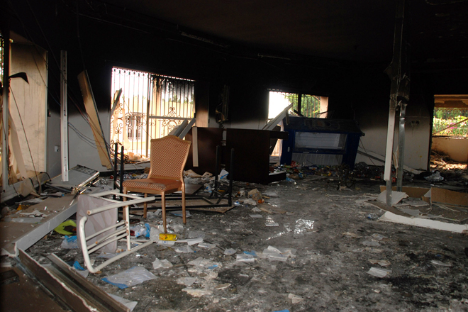 Glass, debris and overturned furniture are strewn inside a room in the gutted U.S. consulate in Benghazi, Libya. (AP/Ibrahim Alaguri)
