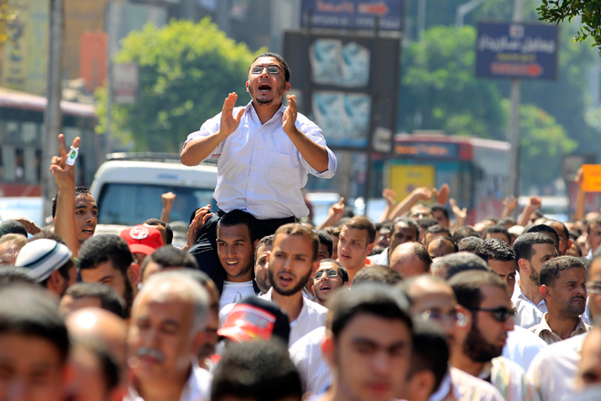 A man cheers during a Muslim Brotherhood protest in Cairo in support of the uprising in Syria. (Reuters/Mohamed Abd El Ghany)