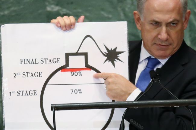 Israeli Prime Minister Benjamin Netanyahu points to a red line he drew on a graphic of a bomb while addressing the United Nations General Assembly.