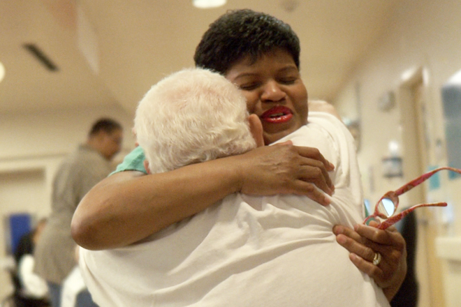 Nurse's assistant Cynthia Johnson offers comfort.