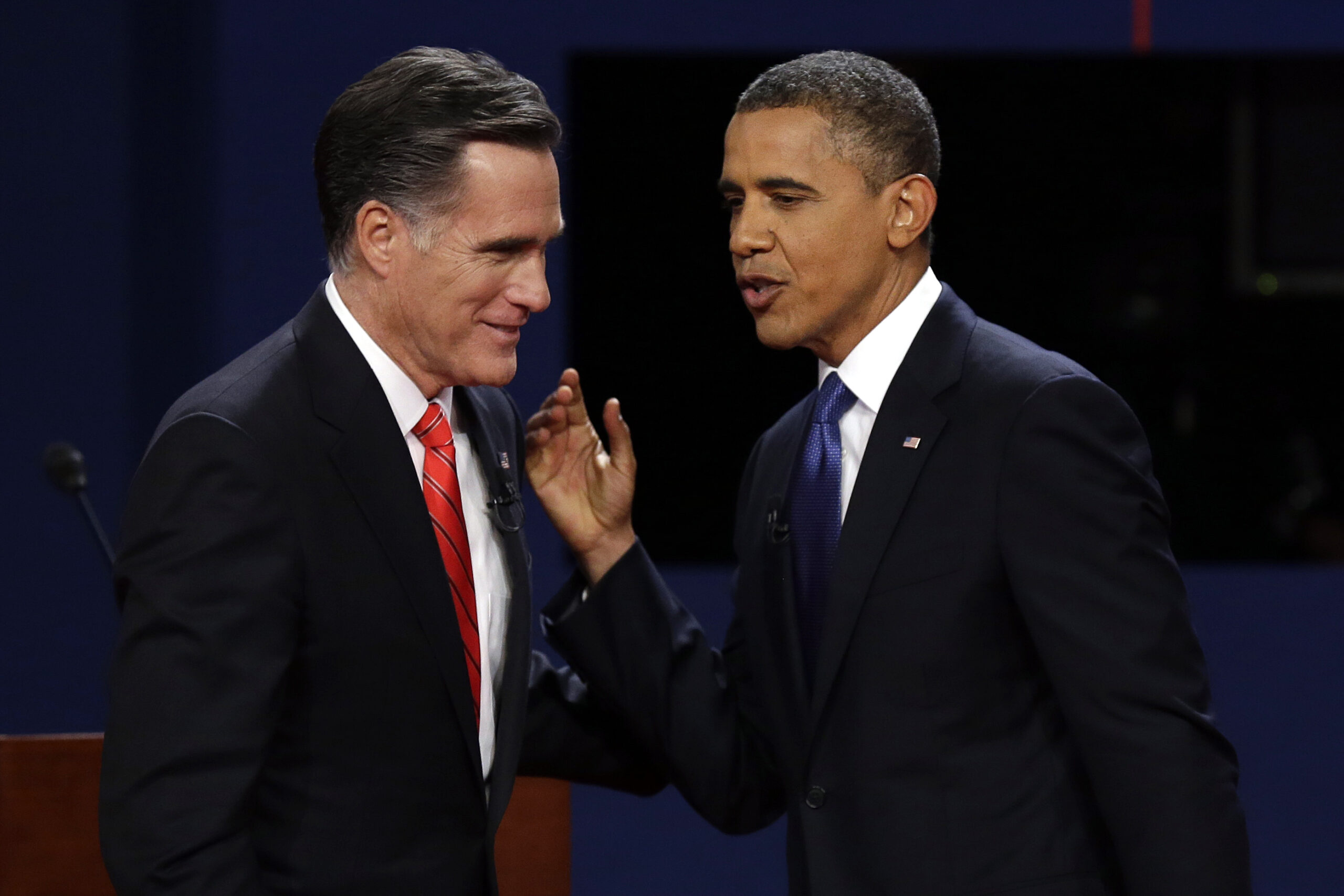 Republican presidential nominee Mitt Romney and President Barack Obama  talk after the first presidential debate. (AP/Charlie Neibergall)