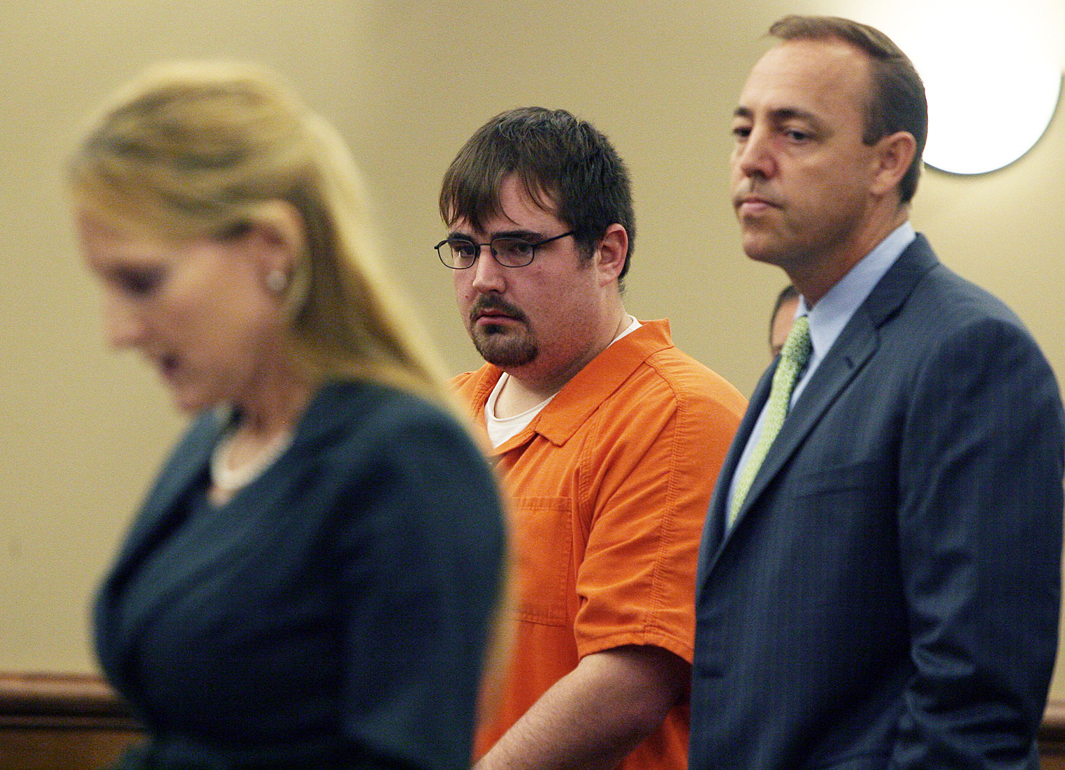 Former Pfc. Christopher Jenderseck, center and his attorney Jarrett Maillet listens as Assistant District Attorney Isabel Pauly, left. (AP/Lewis M. Levine)