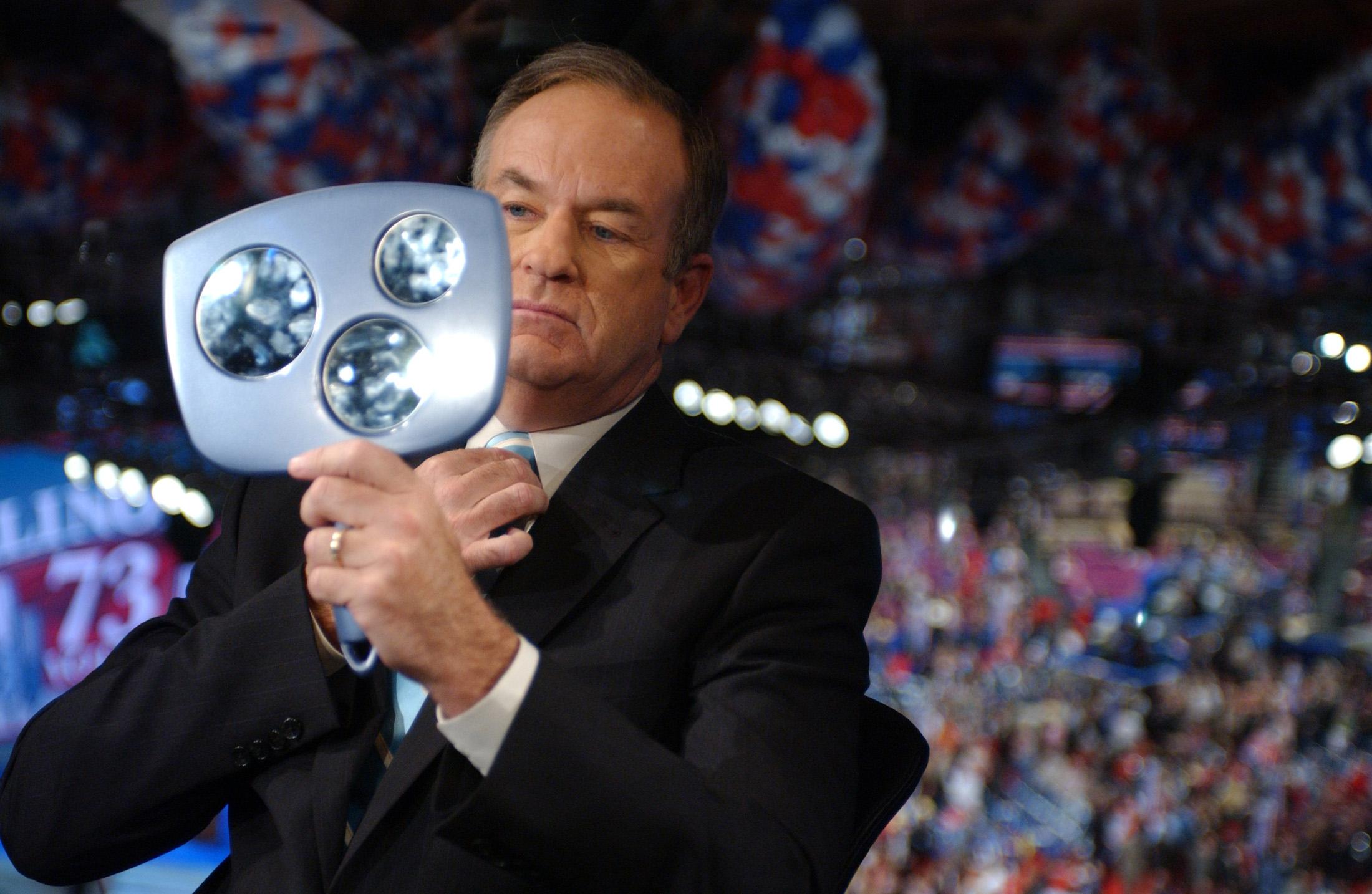 Commentator Bill O'Reilly checks himself out before an interview at the Republican National Convention. (Reuters/Lisa Miller)
