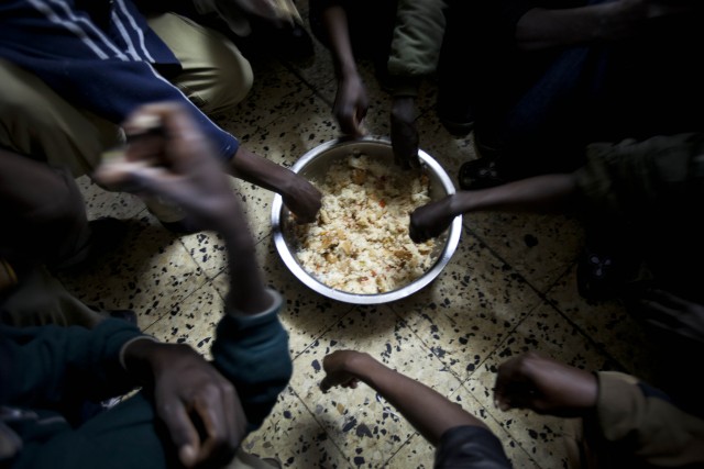 African refugees share breakfast at a shelter in Tel Aviv. (AP/Oded Balilty)