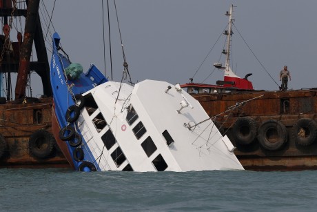At least 36 killed in crash (AP Photo/Vincent Yu)