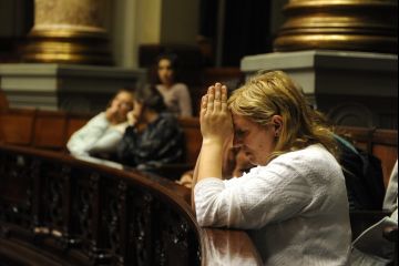 A Uruguayan woman prays at Uruguayan senate as lawmakers debate legalizing abortion. (Miguel Rojo/AFP/Getty Images)
