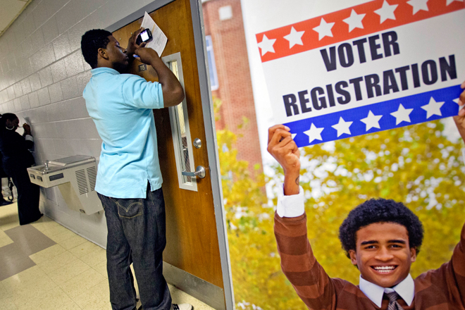 A man fills out a voter registration form in Atlanta on Sept. 12. (AP/David Goldman)
