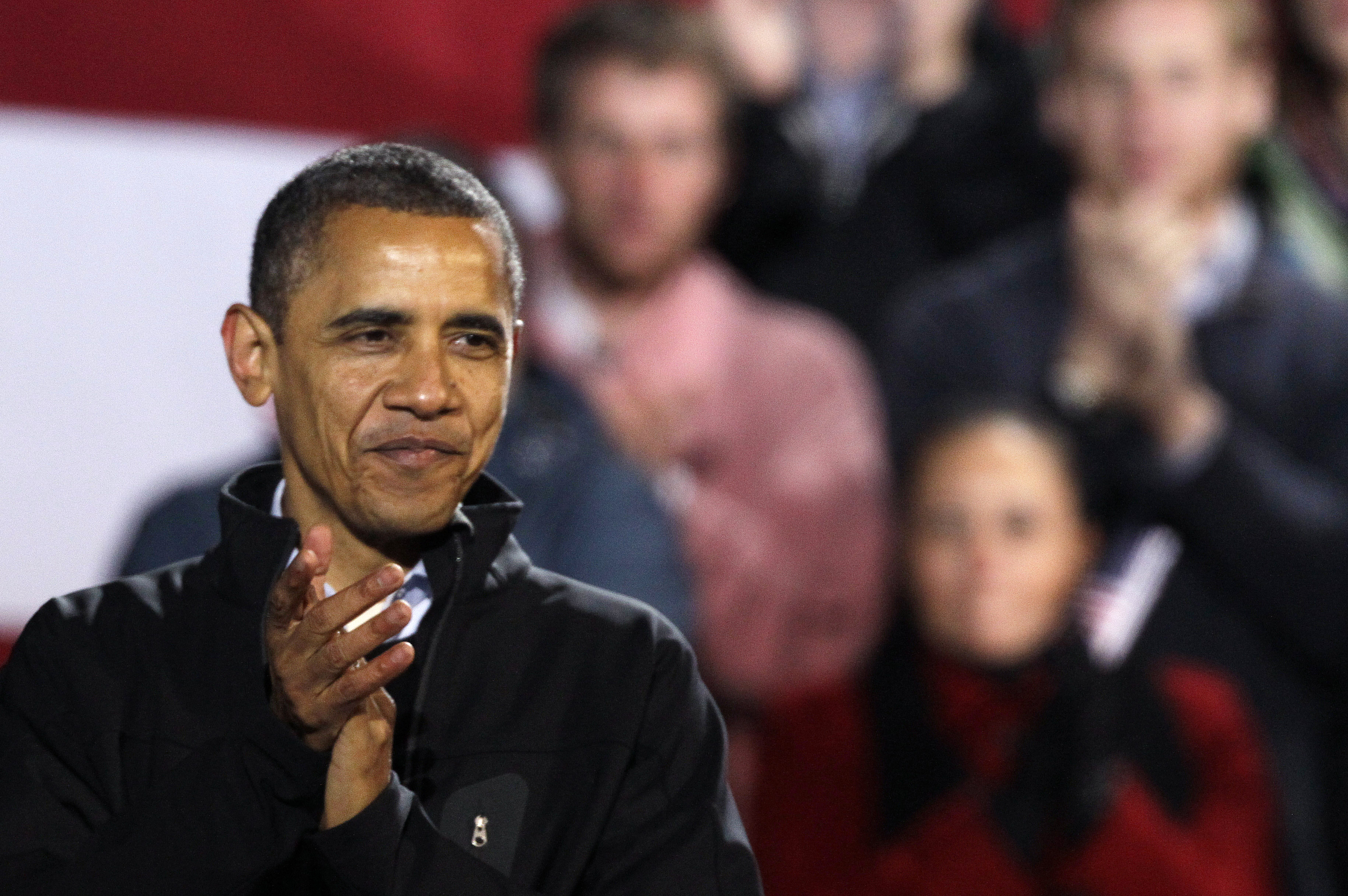 President Barack Obama applauds at a campaign rally at the Community College of Aurora, in Aurora, Colo. (AP/Brennan Linsley)