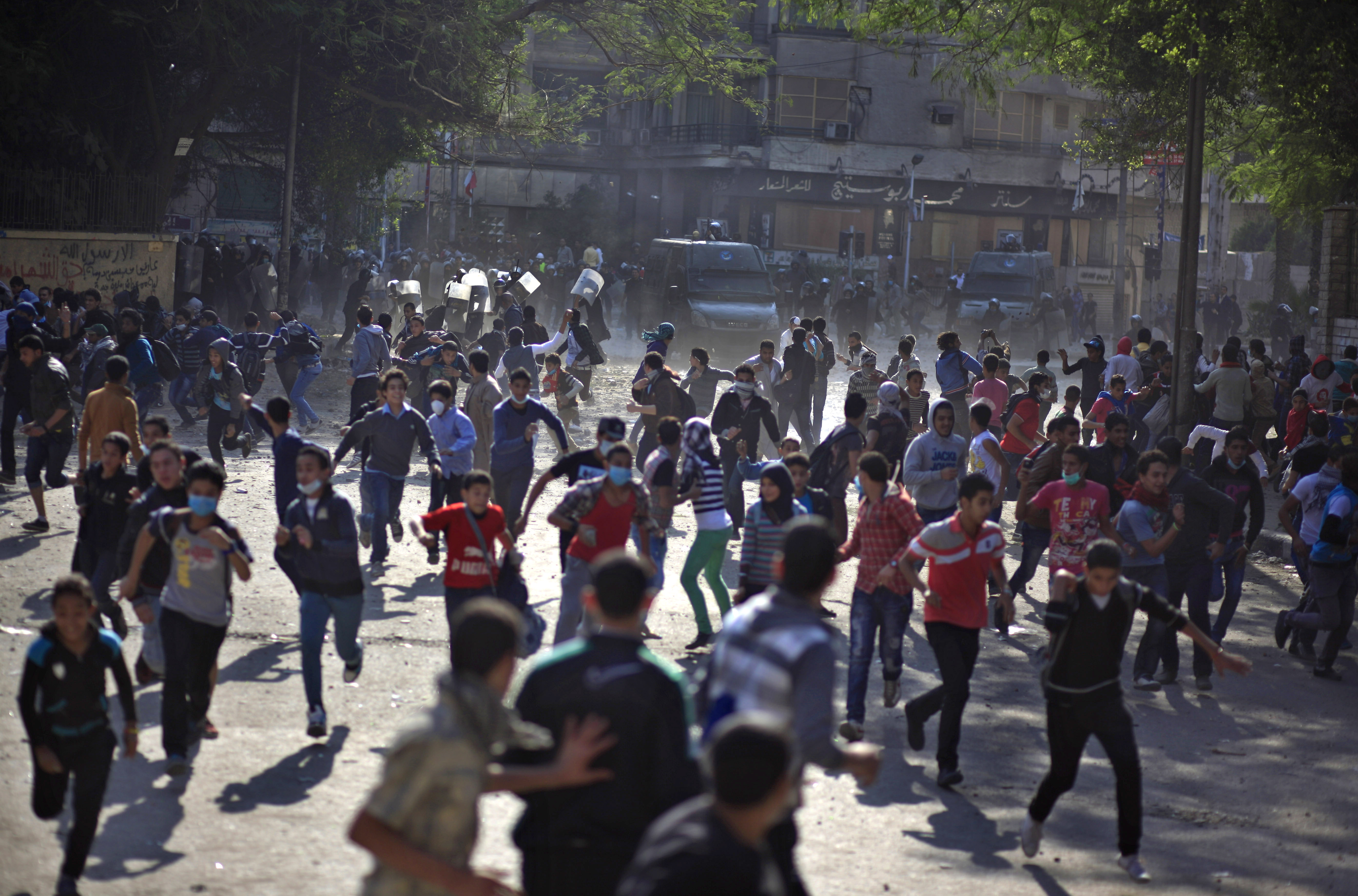 Egyptian protesters clash with security forces near Tahrir square, in Cairo, Egypt. (AP/Khalil Hamra)