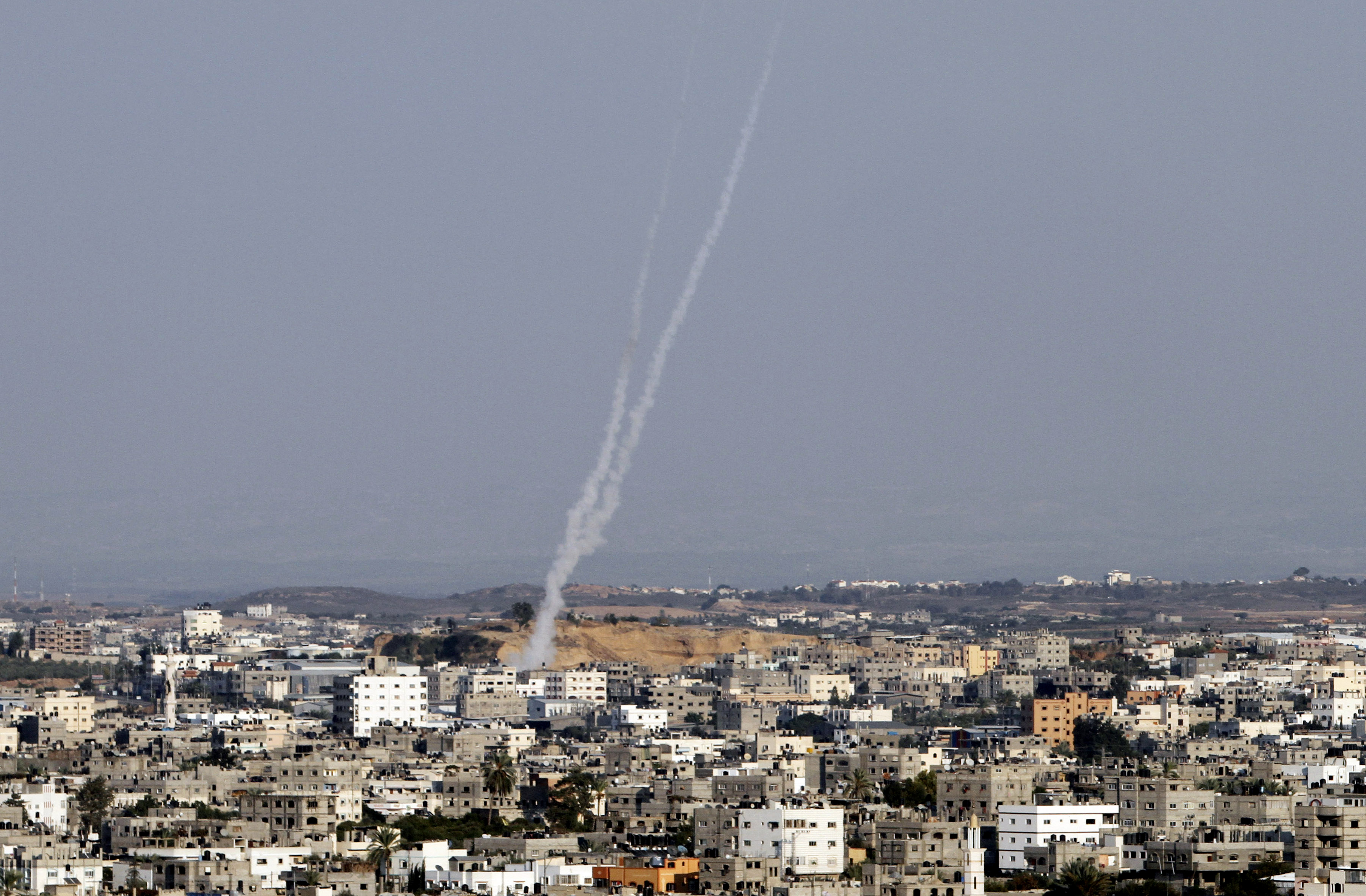 Smoke trails are seen after missiles were fired by Palestinian militants from Gaza City towards southern Israel, Thursday. (AP/Hatem Moussa)