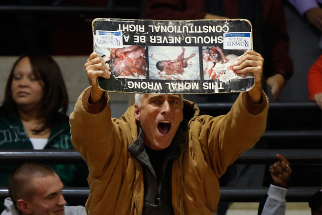 An anti-abortion protester at an Obama campaign event at the University of Cincinnati on Nov. 4. (Reuters/Larry Downing)