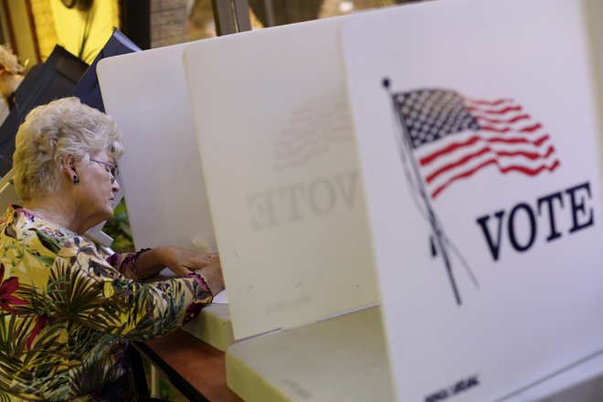 A voter fills out her ballot during early voting at the Gila County Recorders office in Globe, Arizona October 26, 2012. (Reuters/Joshua Lott)