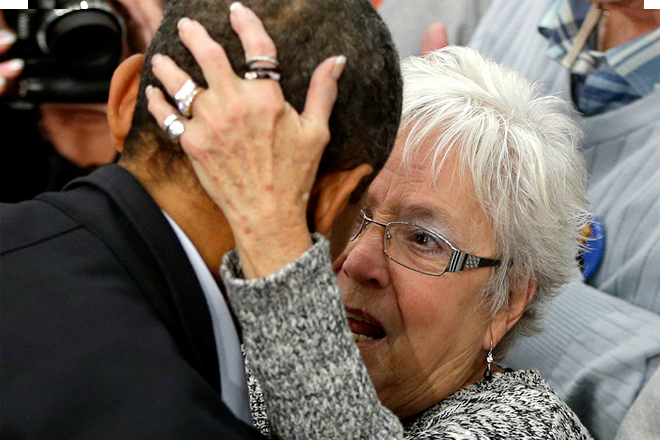 An unidentified supporter grabs the back of President Barack Obama's head during the president's campaign event at Springfield High School, Friday, Nov. 2, 2012, in Springfield, Ohio. (AP Photo/Pablo Martinez Monsivais) (Pablo Martinez Monsivais)