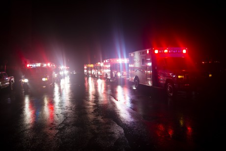 Ambulances wait outside New York University Tisch Hospital during an evacuation of the hospital after its backup generator failed. (AP/John Minchillo)