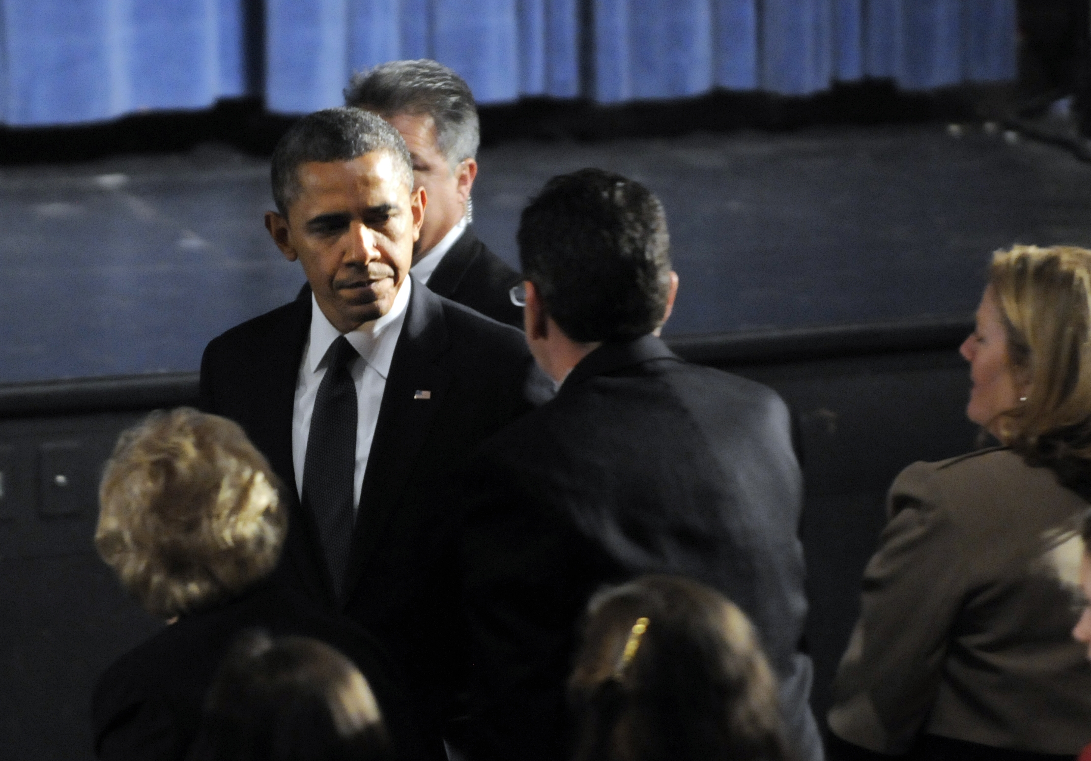 President Barack Obama greets Gov. Dannel Malloy during his arrival at the start of an interfaith vigil for the victims of the Sandy Hook Elementary School shooting. (AP/The Hartford Courant, Stephen Dunn, Pool)