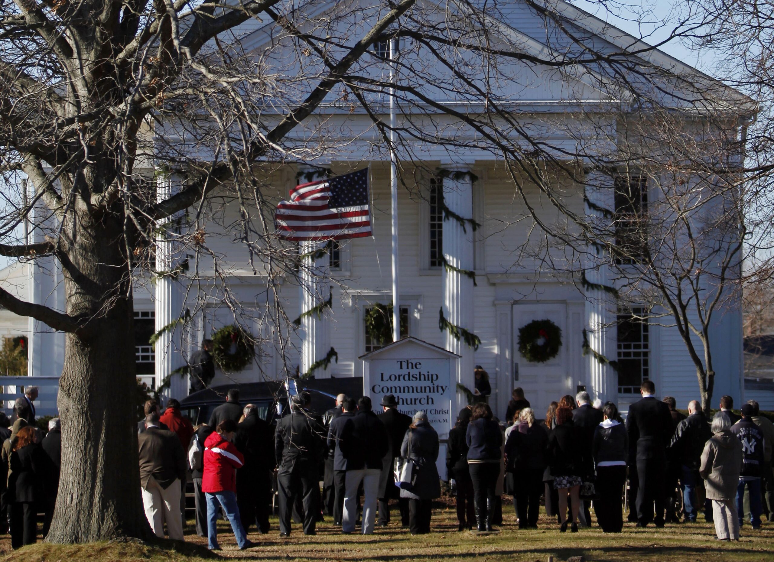 Mourners listen to the funeral service of Victoria Soto over loudspeakers in an overflow area outside Lordship Community Church. (AP/Jason DeCrow)