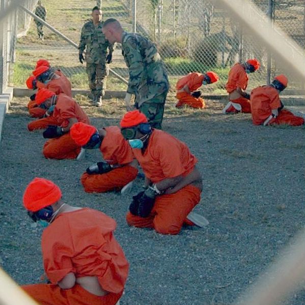 Detainees at Camp X-Ray, Guantanamo Bay (Wikimedia)